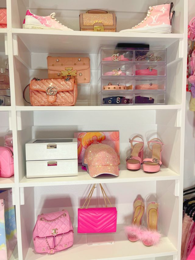 Open shelving holding handbags, jewellery trays and heels in a dressing room