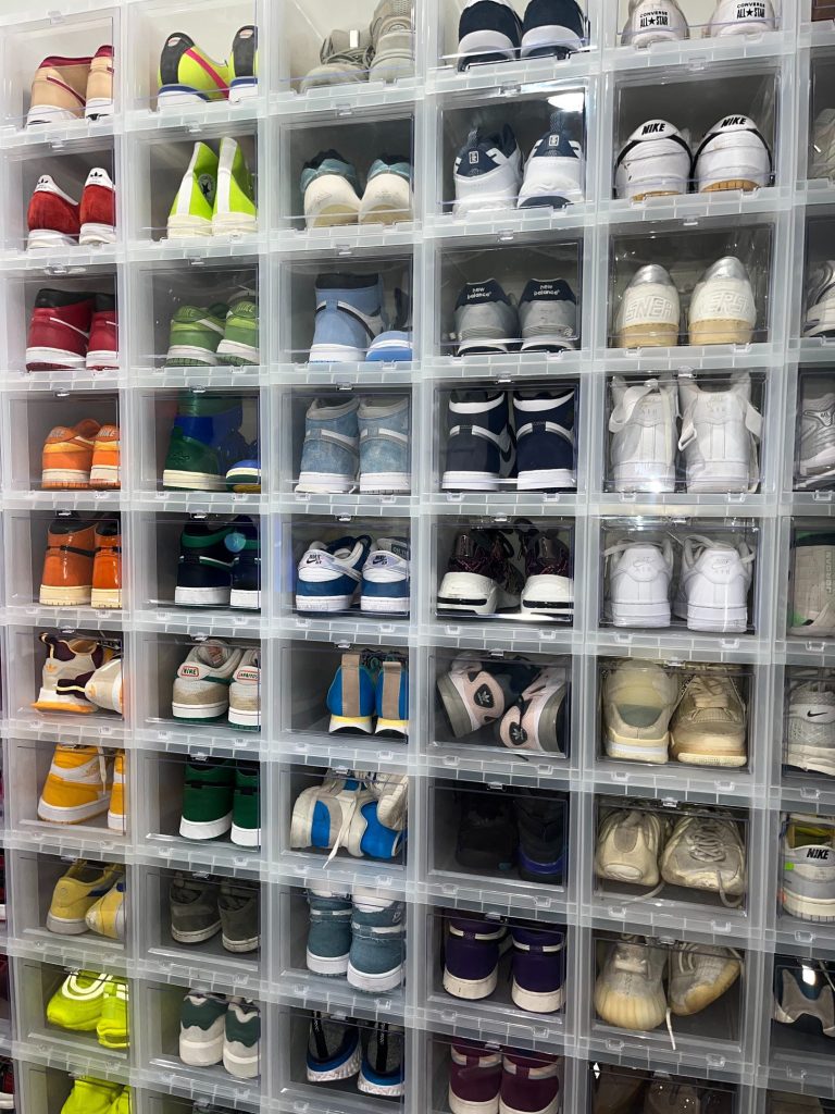 Sneakers stored on closet shelving to maximize vertical space