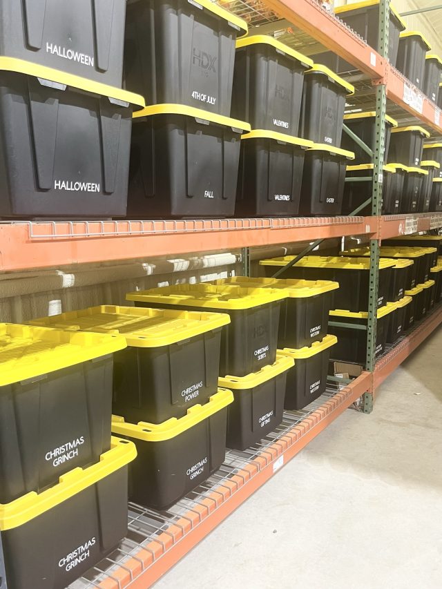 Garage pallet racking filled with labeled black-and-yellow storage totes