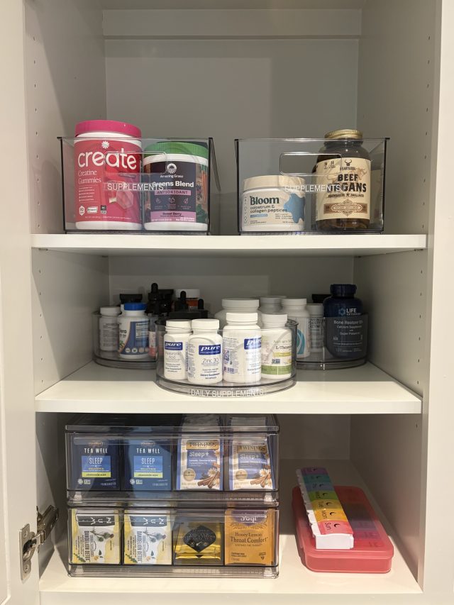 A supplement cabinet with vitamins on a turntable and sachets in a clear bin