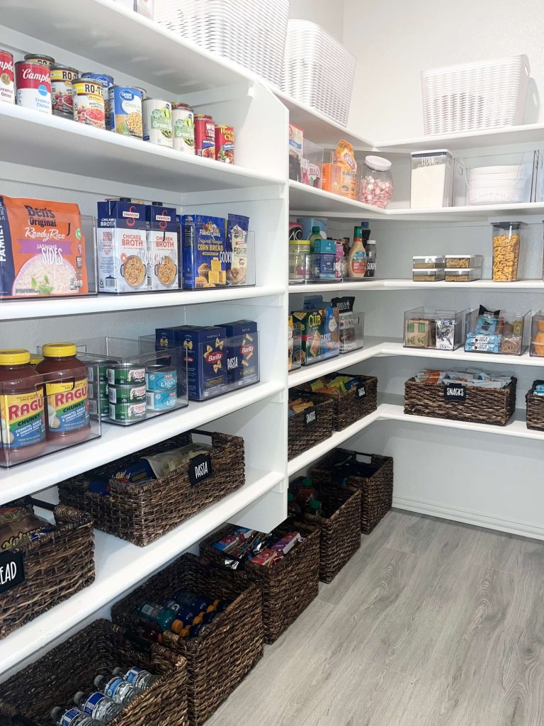 Pantry organized with wicker baskets and structured zones