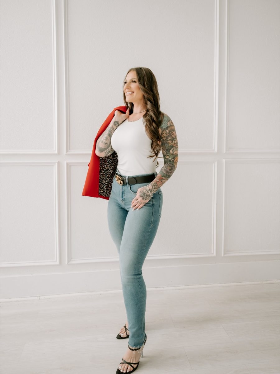 Ashley Matteson with a red blazer over one shoulder